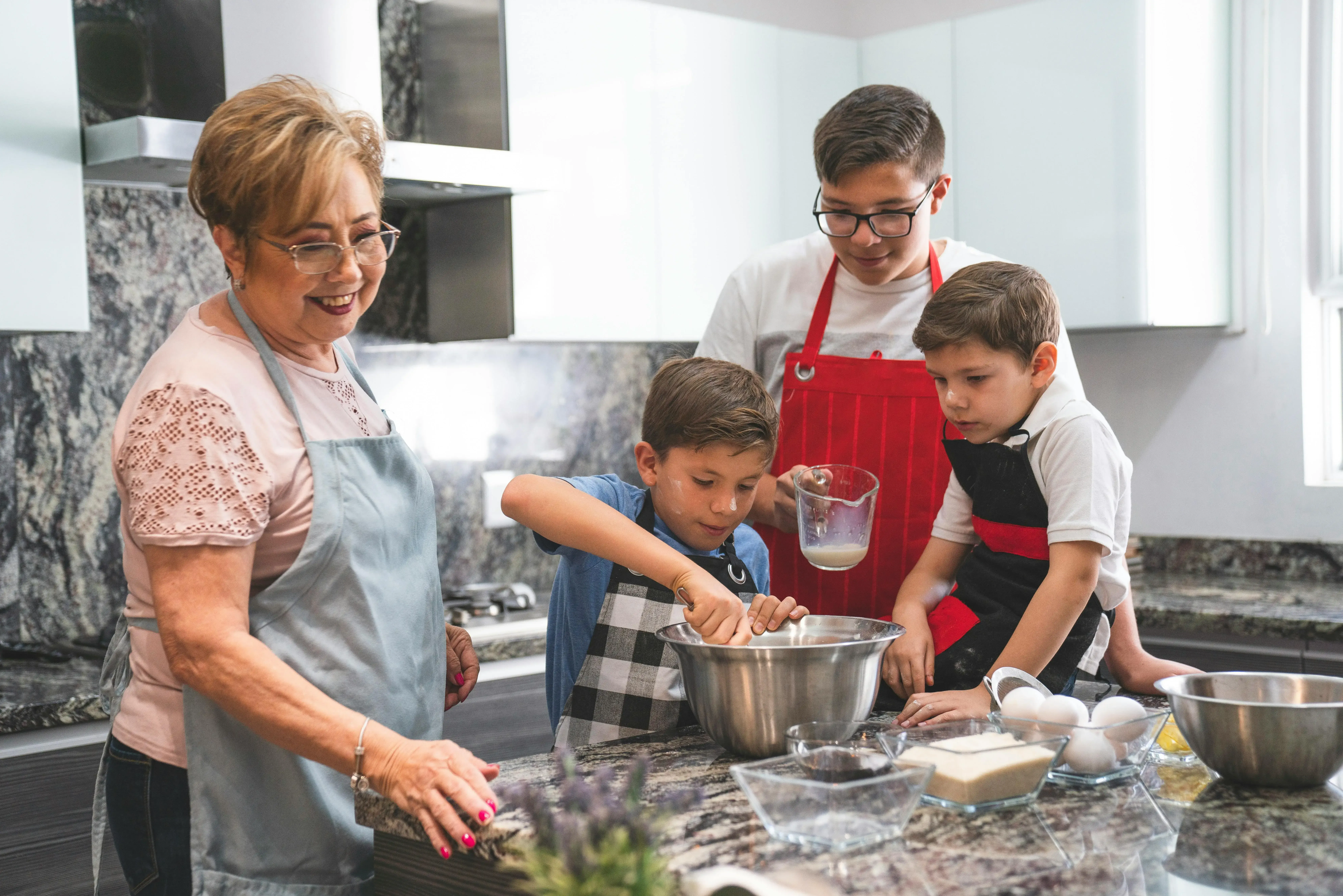 A happy family cooking together in a cozy kitchen, showcasing the joy of shared cooking experiences.