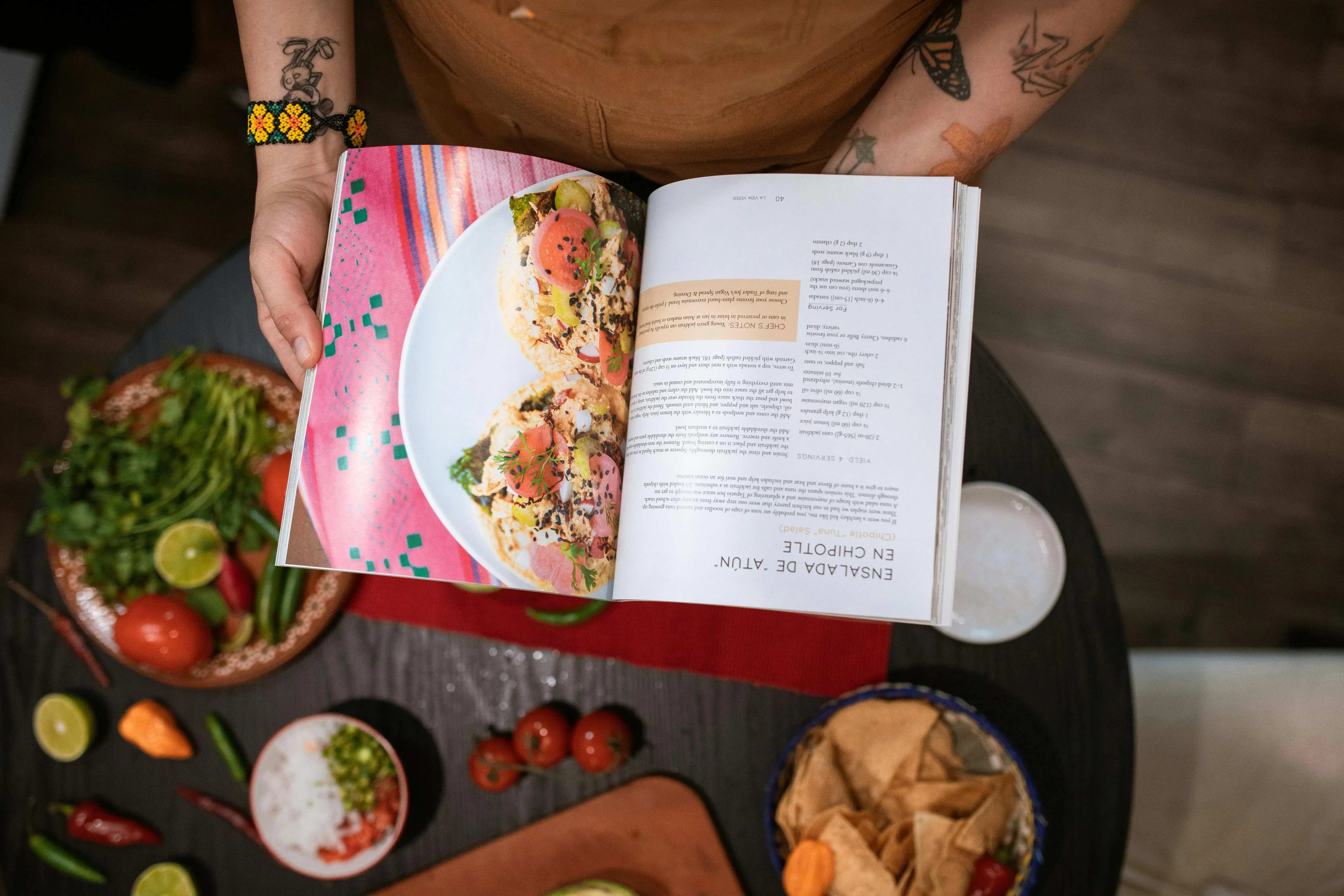 A diverse collection of recipes displayed on a table, including salads, soups, and main dishes.